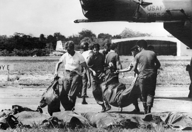 U.S. military personnel remove bags containing bodies in the mass Jonestown suicide in November 1978 in Guyana. (AFP/Getty Images)