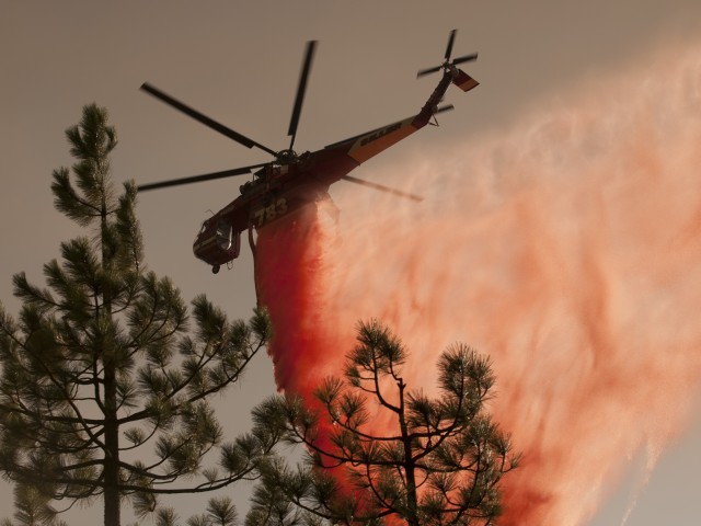 The Happy Camp Complex spread rapidly through the mountains south of the Klamath River in late August, prompting an aggressive air attack that employed helicopters capable of dropping retardant or water. (Kari Greer)