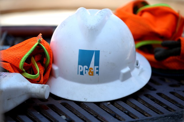 The PG&E logo is displayed on a hard hat at a work site earlier this summer. (Justin Sullivan/Getty Images)
