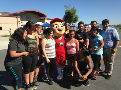 Shelly Pistacio with members of the Modesto High Band at the Wood Colony Country Fair. (Lisa Morehouse/KQED)