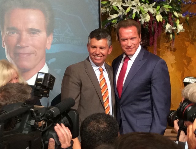 Former Gov. Arnold Schwarzenegger poses with former Lt. Gov. Abel Maldonado at the unveiling of Schwarzenegger's portrait. (Photo: John Myers/KQED)