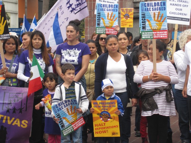Members of Mujeres Unidas y Activas joined dozens of others at an Aug. 2 march in San Francisco's Mission District to call for humanitarian treatment of children from Central America. (Zaidee Stavely/KQED)