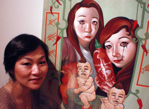 Phung Huynh and her Sriracha-inspired painting "LAH" at the "L.A. Heat" exhibit in Los Angeles. (Steven Cuevas/KQED)