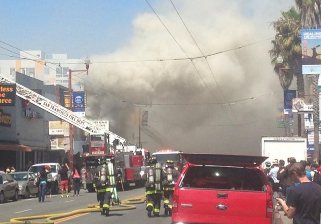 San Francisco firefighters responding to a blaze on Mission Street between 22nd and 23rd streets. (Lee Fang via Twitter)