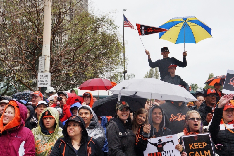 Despite the rain, hundreds of thousands of fans came out to see the parade. (James Tensuan/KQED)