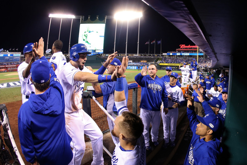 Eric Hosmer returns to the dugout after scoring in the sixth inning. (Elsa/Getty Images)