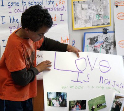 A Malcolm X fourth-grader makes a presentation on what love means to him. (Sara Bernard/KQED)