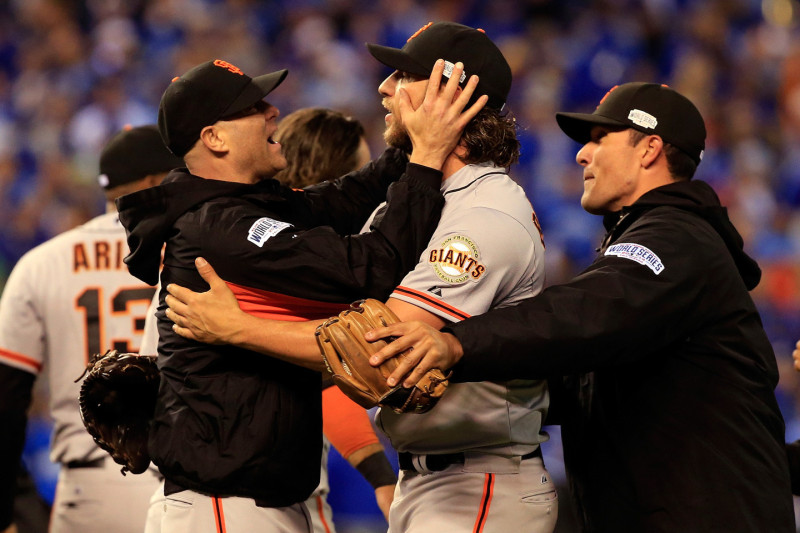 Tim Hudson #17 celebrates with Madison Bumgarner #40 on the field after defeating the Kansas City Royals 3-2 to win Game Seven of the 2014 World Series. (Jamie Squire/Getty Images)