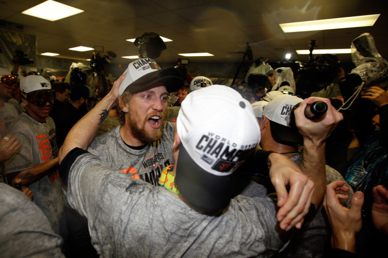 Hunter Pence of the San Francisco Giants celebrates with teammates in the locker room after defeating the Kansas City Royals in the World Series. (Ezra Shaw/Getty Images)