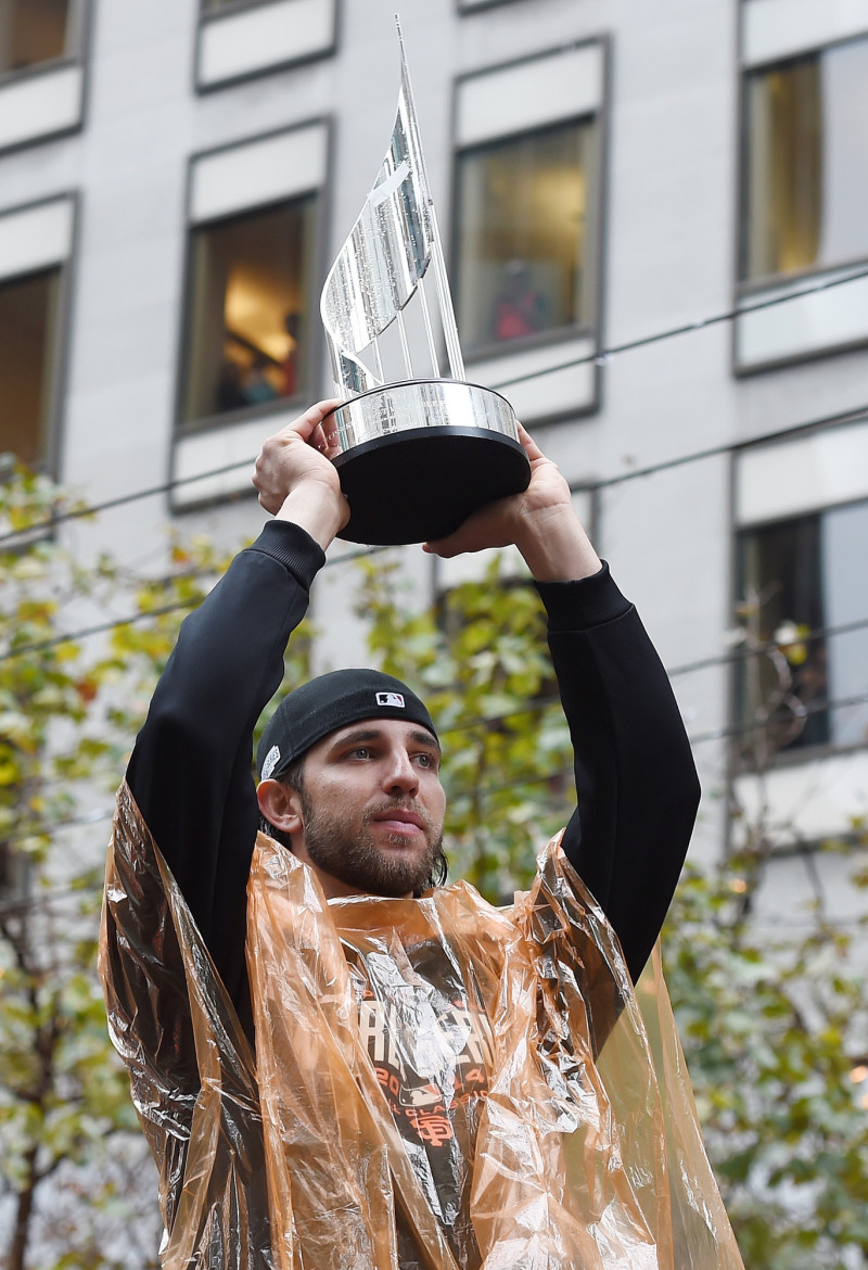 World Series MVP Madison Bumgarner shows his MVP trophy to the crowd along the parade route. (Thearon W. Henderson/Getty Images)