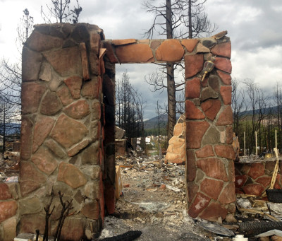 This stone entryway is all the Boles Fire left standing of this home in Weed. (Daniel Potter/KQED)