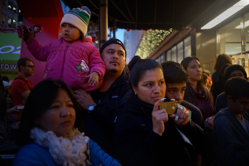 Alma Quintero, center, takes a video students from the De Marillac Academy sing at the unveiling of the Holiday Windows at Macy's  in San Francisco, Calif. on Friday, Nov. 11, 2014. Internet sensation Grumpy Cat was one of the stars of the unveiling of the Holiday Windows at Macy's.
