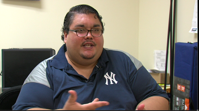LaShawn Encarnacion has been battling morbid obesity and other health problems for years. He hopes the Patient Improvement Health Initiative will help him take better care of himself. (Nic McVicker/KPBS)