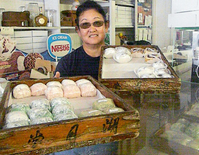 Lynn Ikeda with Japanese mochi made at the Kogetsu-Do bakery. (Alice Daniel/KQED)