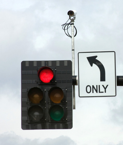 A surveillance camera mounted on a stoplight. (Getty Images)