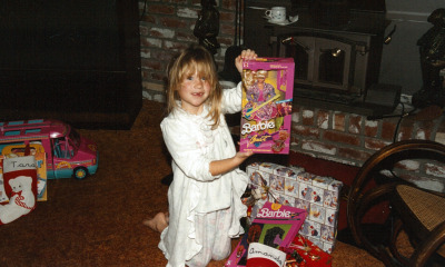 Amanda at six years old, celebrating Christmas with her new Barbie doll. (Avishay Artsy/KQED)