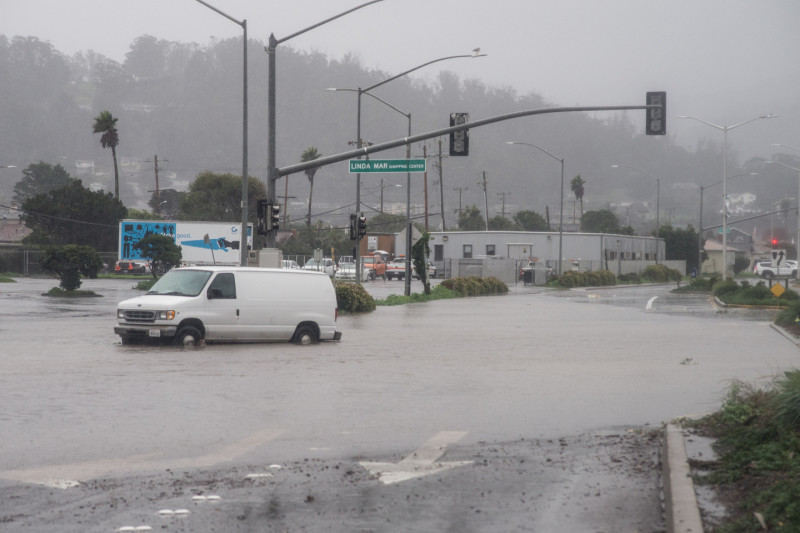 Flooded intersection in front of the Lindamar Shopping Center on Lindamar Boulevard in Pacifica, the morning of December 11. (Steve Byrne/KQED) 