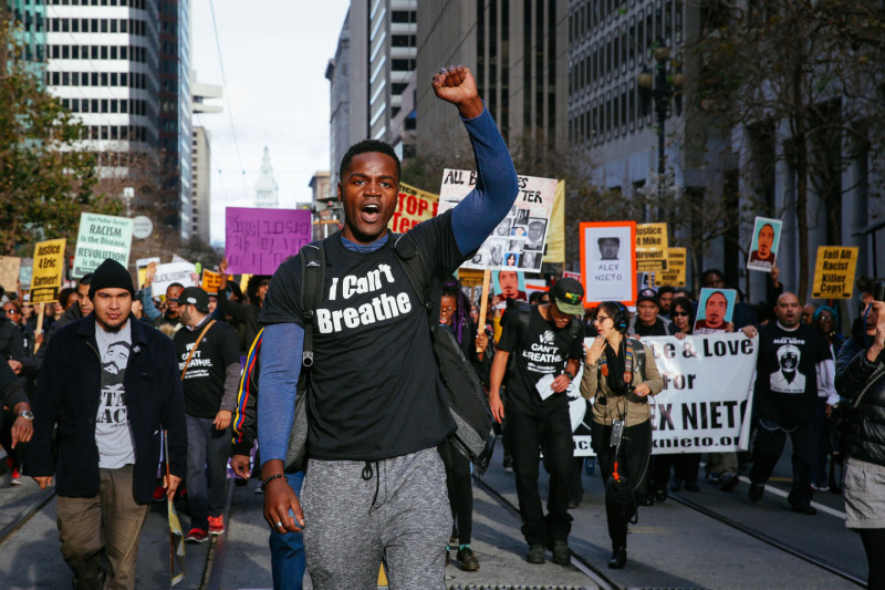 Thousands protesting police brutality marched down Market street in San Francisco on Saturday December 13, 2014. (Jeremy Raff/KQED)