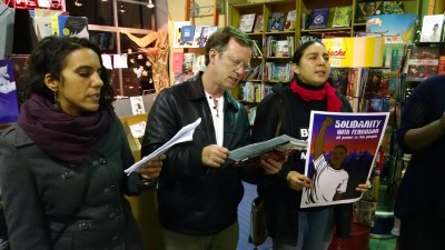Protesters sing inside the Diesel bookstore on College Avenue in Oakland. (Andrew Stelzer/KQED)
