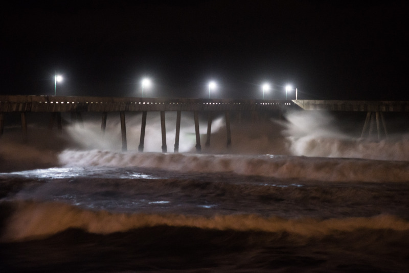 High surf rolls into the pier at Pacifica overnight. (Steven Byrne/KQED)