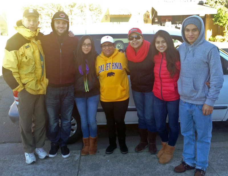 The crew, after passing out all the tamales in West Berkeley. Tejada is center, with the yellow sweatshirt. Muñoz is third from the left. (Isabel Angell/KQED)