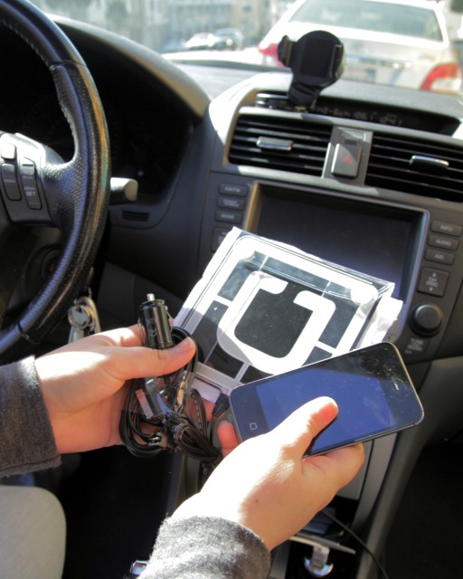 UberX drivers receive a company phone and emblem after signing up. (Jeremy Raff/KQED)