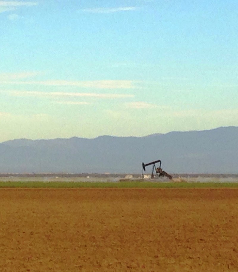 A lone oil pumpjack plies the earth in Kern County near Bakersfield. 