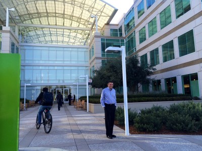 Prominent local Silicon Valley developer John M. Sobrato standing in front of the Apple headquarters he built in Cupertino in 1992. 