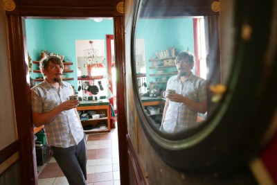Shalaco Shing, a photographer, has lived at the Merry-Go-Round House; since 2009. (Jeremy Raff/KQED)