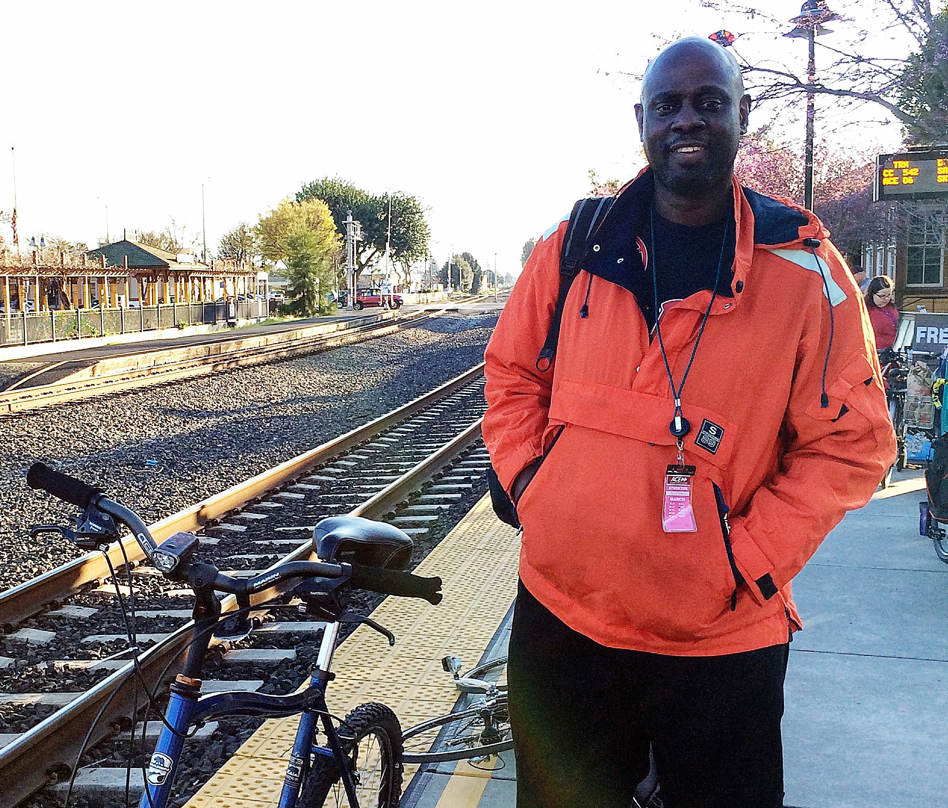 Thomas waits for the Stanford commuter bus at Fremont train station.