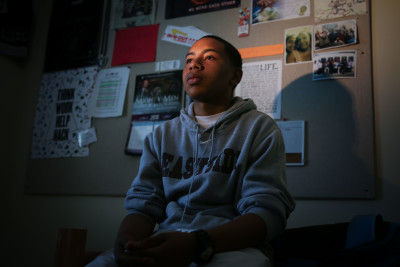 Diamond Allen, pictured in his dorm room at his new school, Eastside College Preparatory College. (Jeremy Raff/KQED)