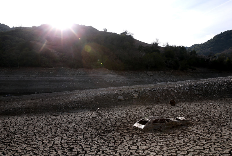  A car sits in dried and cracked earth of what was the bottom of the Almaden Reservoir on January 28, 2014 in San Jose, California.