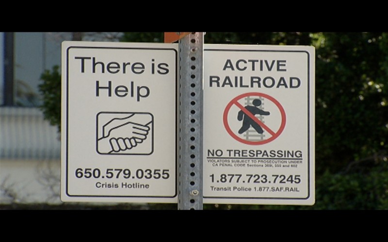 Hundreds of signs along Caltrain tracks and stations urge people to reach out for support.