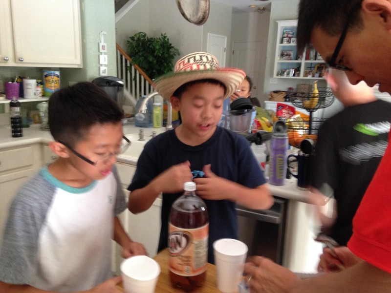 The kids take a root beer float break with their coach Kevin Murai. 