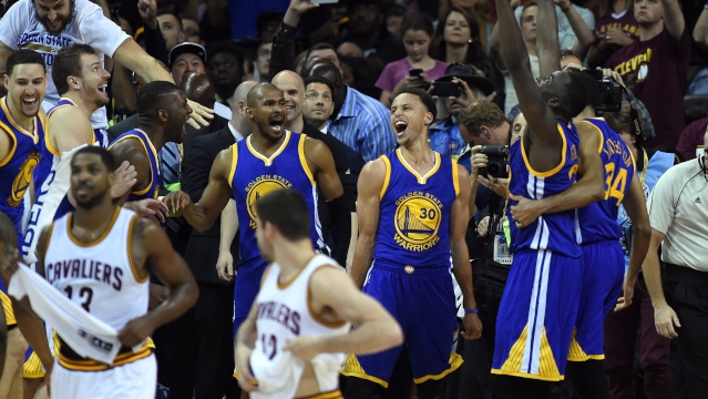 The Golden State Warriors celebrate defeating  the Cleveland Cavaliers 105-97 in Game 6. 