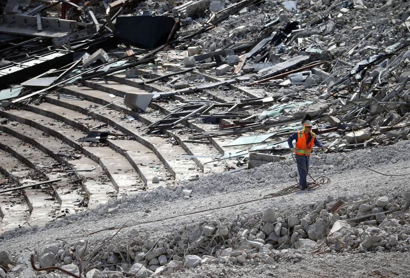 June 9: A worker amid the Candlestick Park rubble.