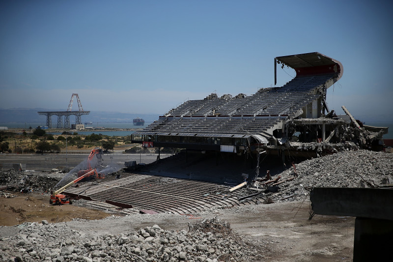 June 26: One final section of Candlestick Park remained standing. In the distance: the site of the old Hunters Point Naval Shipyard.