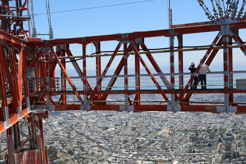 Reporter Jessica Placzek and Sutro Tower Spokesman Dave Hyams near the top of the tower.