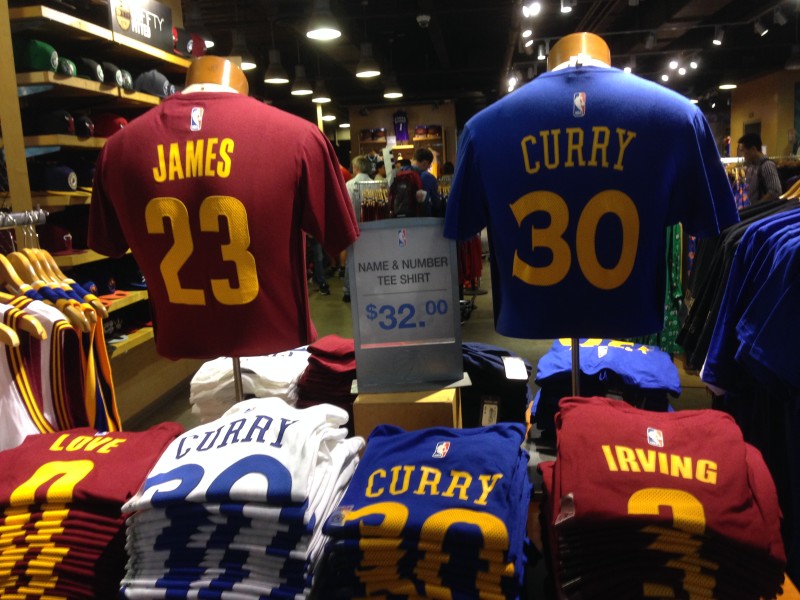 Curry and James t-shirts on display at an NBA Store in York City during the NBA Finals. (Pat Yollin/KQED).