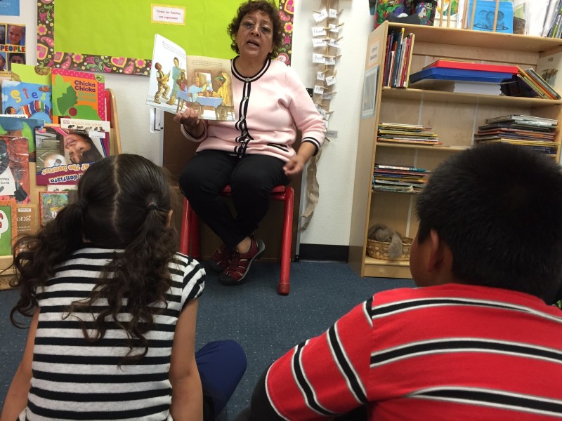 Amapola Beenn reads to her students in Spanish. Later another teacher will read to the group in English.