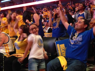 Fans packed Oracle Arena during the Game 6 Watch Party Tuesday night. The Torres family said they needed to be somewhere memorable for game six. (Devin Katayama/KQED)