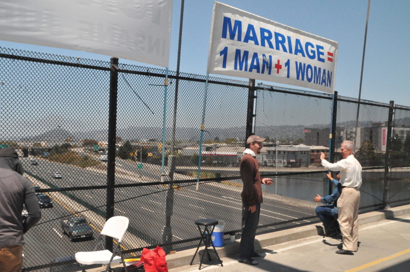Protesters in Berkeley wave a sign opposing same-sex marriage.