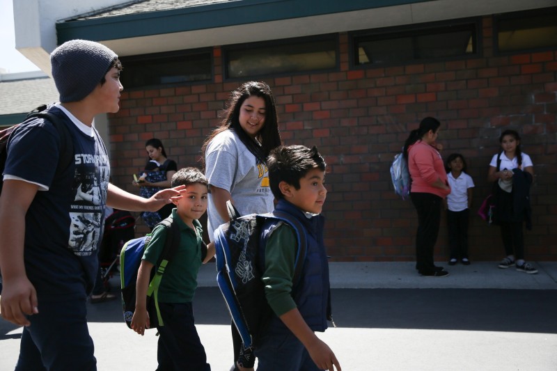 Jose Daniel walks home from school with brothers Valentin and Bryan and sister Lidia.