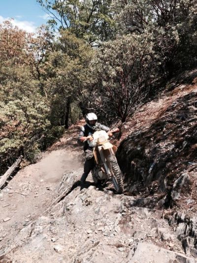 Searcher on a dirt bike on a rugged trail in El Dorado National Forest. San Francisco high school teacher went missing in the forest after leaving on a ride July 17.