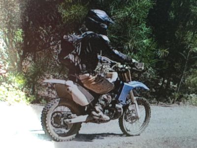 This image of Ed Cavanaugh on his dirt bike was taken July 17 by a wildlife camera in El Dorado National Forest. 
