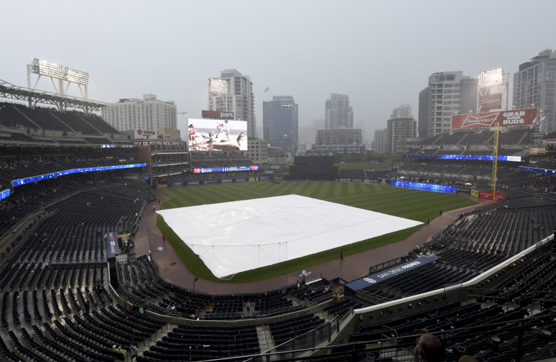 A tarp covers the field at Petco Park during a baseball game between the Colorado Rockies and the San Diego Padres July 19, 2015 in San Diego, California.  Play was suspended in the fifth inning. 