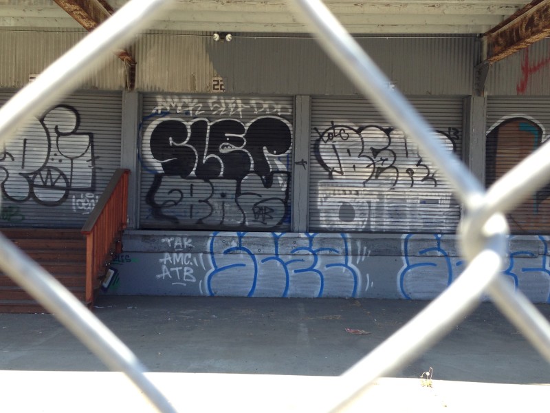 Across from the "cool art" is the more typical graffiti that business argue leads to blight and other problems.