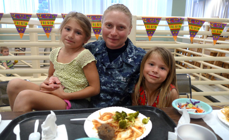 Hospital Corpsman Barbara Melendez and her daughters Maida and Melinda are USO regulars.