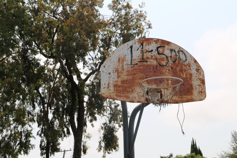 The park's tattered basketball hoops have sat unused for over a decade.