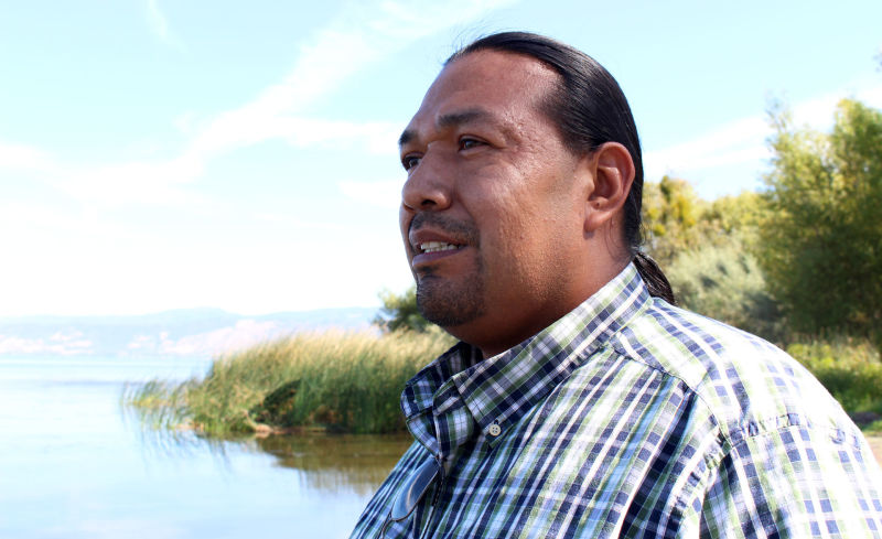 Batsulwin Brown, tribal historic preservation officer for the Big Valley Band of Pomo Indians, at Clear Lake on Sept. 10. Brown is concerned that the lake’s drop in water levels and wildfires are making archaeological sites easier to loot.